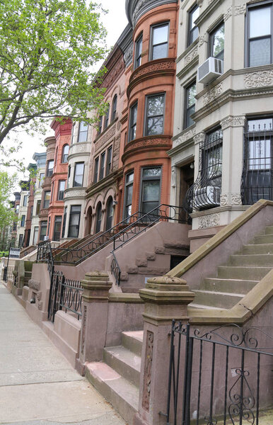 BROOKLYN, NEW YORK - MAY 11, 2017: New York City brownstones at historic Prospect Heights neighborhood. Prospect Heights is an affluent residential neighborhood within the New York borough of Brooklyn