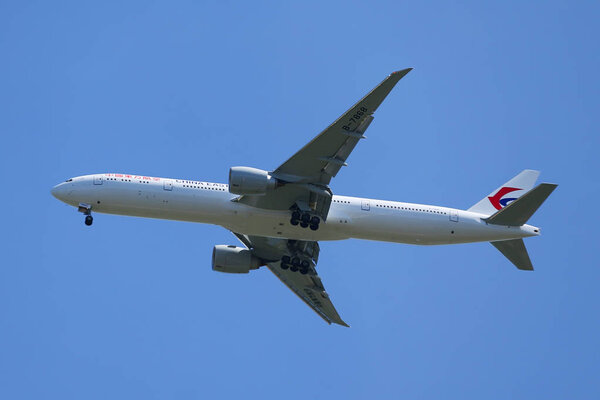 China Eastern Airlines Boeing 777 descends for landing at JFK International Airport in New York
