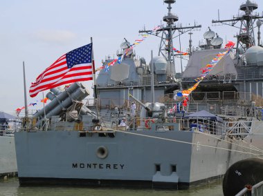 US Navy Ticonderoga-class cruisers USS Monterey docked in Brooklyn Cruise Terminal during Fleet Week 2017 in New York.  clipart