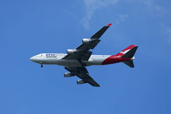 Qantas Airways Boeing 747 in New York sky before landing at JFK Airport.