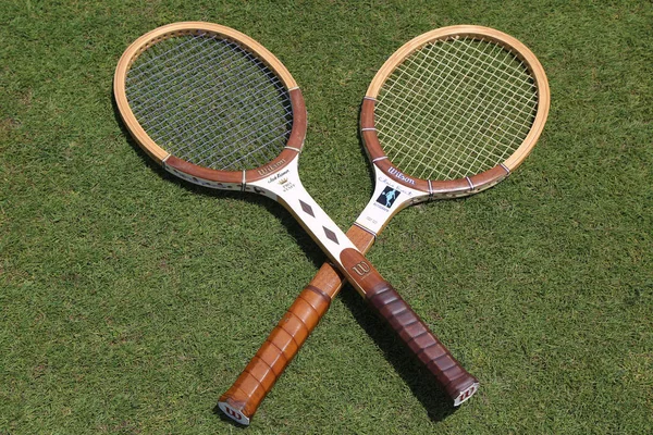 Vintage Wilson tennis rackets on the grass tennis court. — Stock Photo, Image