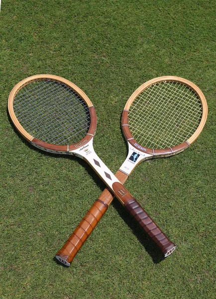 Vintage Wilson tennis rackets on the grass tennis court. — Stock Photo, Image