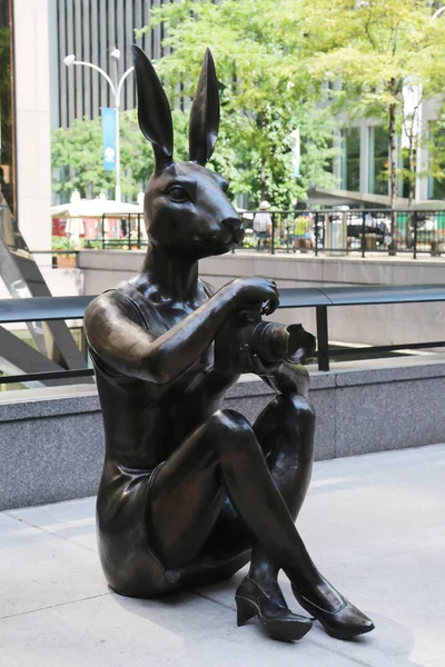 Paparazzi Dogman and Paparazzi Rabbitgirl sculpture by world-famous contemporary artists Gillie and Marc at the Avenue of the Americas in midtown Manhattan — Stock Photo, Image