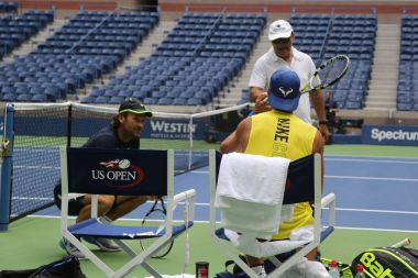 Fifteen times Grand Slam Champion Rafael Nadal of Spain with his coaches Tony Nadal (R) and Carlos Moya during practice for US Open 2017 clipart