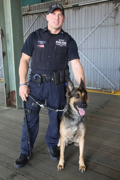 NYPD counter terrorism bureau K-9 police officer and K-9 dog providing security in New York Stock Picture