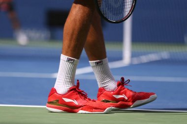 Professional tennis player Marin Cilic of Croatia wears custom Li Ning tennis shoes during his first round match at 2017 US Open clipart