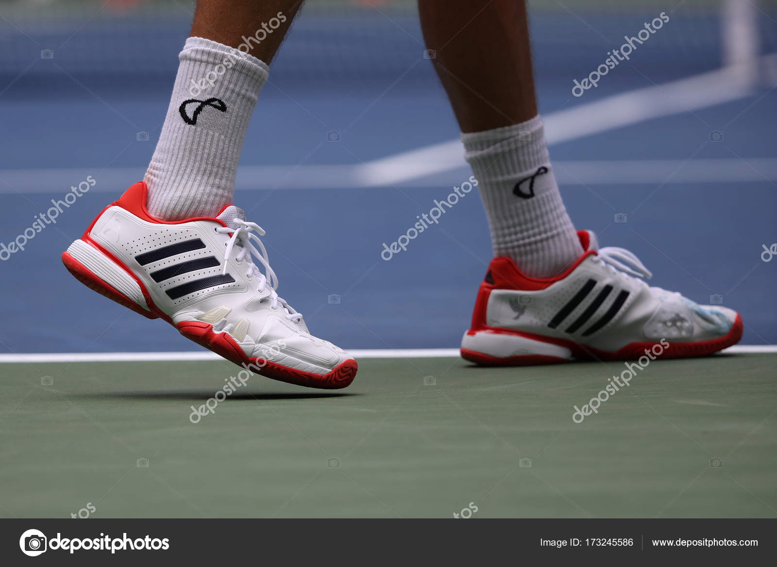 Professional tennis player Tennys Sandgren of USA wears Adidas special edition Babolat 7 Djokovic tennis shoes during his 2017 US first round match – Stock Editorial Photo © zhukovsky #173245586