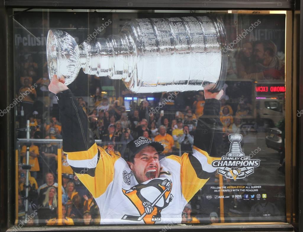 NEW YORK - NOVEMBER 16, 2017: The NHL shop windows decoration showing the Pittsburgh Penguins player with Stanley Cup in Midtown Manhattan.