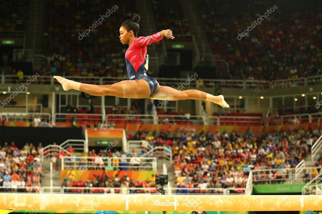 RIO DE JANEIRO, BRAZIL AUGUST 7, 2016: Olympic champion Gabby Douglas of United States competes on the balance beam at women's all-around gymnastics qualification at Rio 2016 Olympic Games