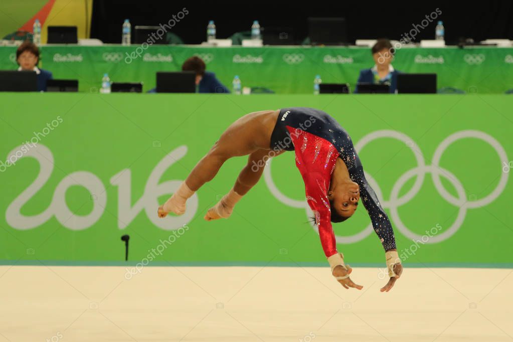RIO DE JANEIRO, BRAZIL - AUGUST 7, 2016: Olympic champion Gabby Douglas of United States competes on the floor exercise during women's all-around gymnastics qualification at Rio 2016 Olympic Games