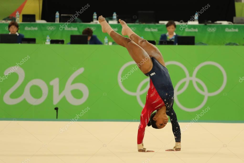 RIO DE JANEIRO, BRAZIL - AUGUST 7, 2016: Olympic champion Gabby Douglas of United States competes on the floor exercise during women's all-around gymnastics qualification at Rio 2016 Olympic Games