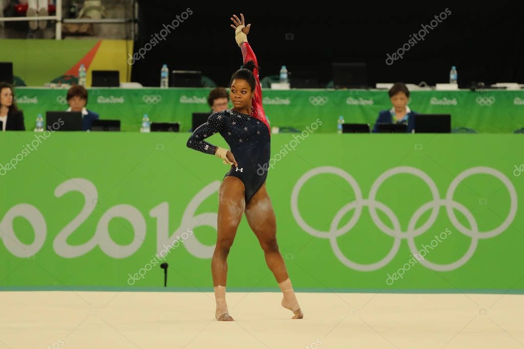 RIO DE JANEIRO, BRAZIL - AUGUST 7, 2016: Olympic champion Gabby Douglas of United States competes on the floor exercise during women's all-around gymnastics qualification at Rio 2016 Olympic Games