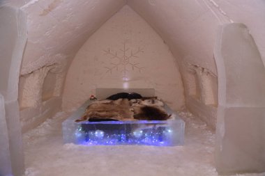 ROVANIEMI, FINLAND - FEBRUARY 16, 2017: Suite at Arctic Snow Hotel in Finnish Lapland. Arctic SnowHotel is located on the Arctic Circle in Finnish Lapland.  clipart