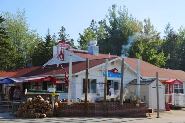 TRENTON, MAINE - JULY 2, 2017: Traditional lobster pound restaurant in Maine. It is a famous location in Down East Maine with a long history of lobstering  clipart