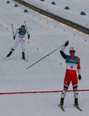 Pyeongchang, Güney Kore - 10 Şubat 2018: tarihteki en dekore edilmiş kış Olympian kitle Norveç Marit Bjoergen başlatmak bayanlar 7.5 km + 7.5 km Skiathlon 2018 Kış Olimpiyatları