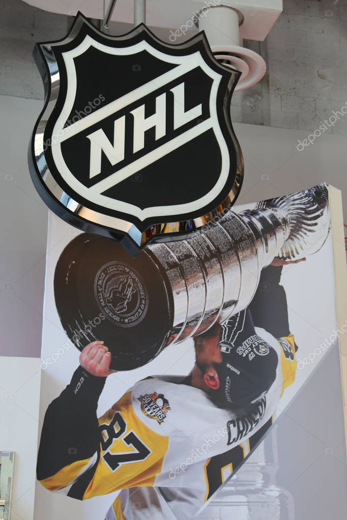 NEW YORK - APRIL 26, 2018: The NHL shop decoration showing the Pittsburgh Penguins captain Sidney Patrick Crosby with Stanley Cup in Midtown Manhattan.