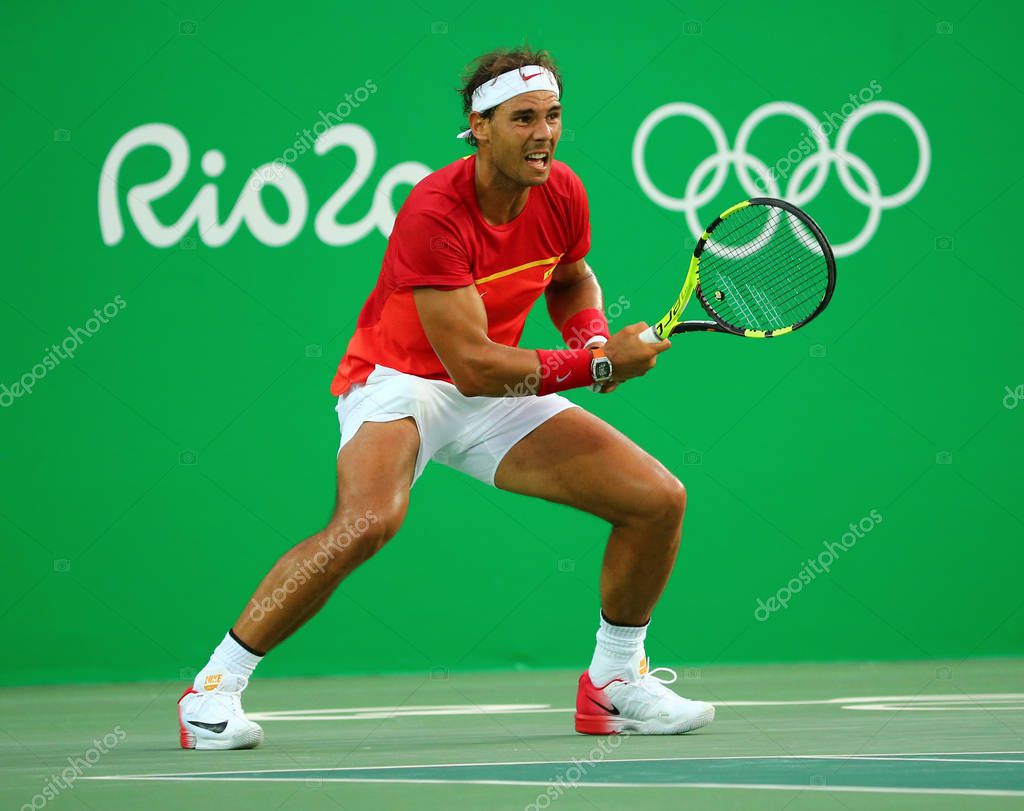 RIO DE JANEIRO, BRAZIL - AUGUST 12, 2016: Olympic champion Rafael Nadal of Spain in action during men's singles semifinal of the Rio 2016 Olympic Games at the Olympic Tennis Centre