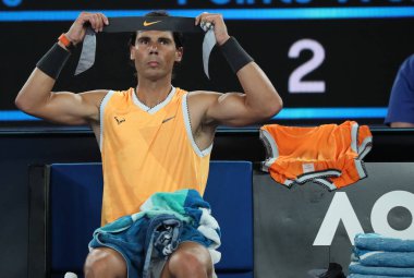 MELBOURNE, AUSTRALIA - JANUARY 22, 2019: Seventeen times Grand Slam champion Rafael Nadal of Spain in action during his  his quarter-final match at 2019 Australian Open in Melbourne Park clipart