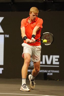 UNIONDALE, NEW YORK - FEBRUARY 16, 2020:  2020 New York Open tennis tournament Champion Kyle Edmund of Great Britain in action during his final match in Uniondale, New York
