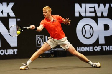 UNIONDALE, NEW YORK - FEBRUARY 16, 2020:  2020 New York Open tennis tournament Champion Kyle Edmund of Great Britain in action during his final match in Uniondale, New York