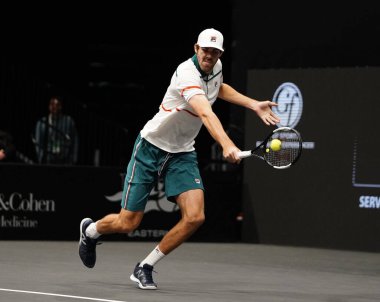 UNIONDALE, NEW YORK - FEBRUARY 16, 2020:  2020 New York Open tennis tournament doubles finalist Reilly Opelka of United states in action during  his final match in Uniondale, New York