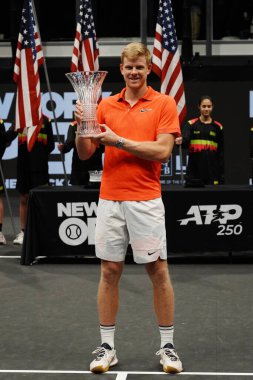UNIONDALE, NEW YORK - FEBRUARY 16, 2020:  2020 New York Open tennis tournament Champion Kyle Edmund of Great Britain during trophy presentation after his final match victory  in Uniondale, New York