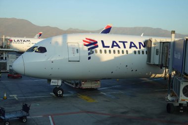 SANTIAGO, CHILE - JANUARY 30, 2020: Latam Airlines plane on tarmac at Arturo Merino Benitez International Airport in Santiago, Chile clipart