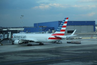 NEW YORK - FEBRUARY 15, 2017: American Airlines plane on tarmac at JFK International Airport. JFK is one of the biggest airports in the world with 4 runways and 8 terminals