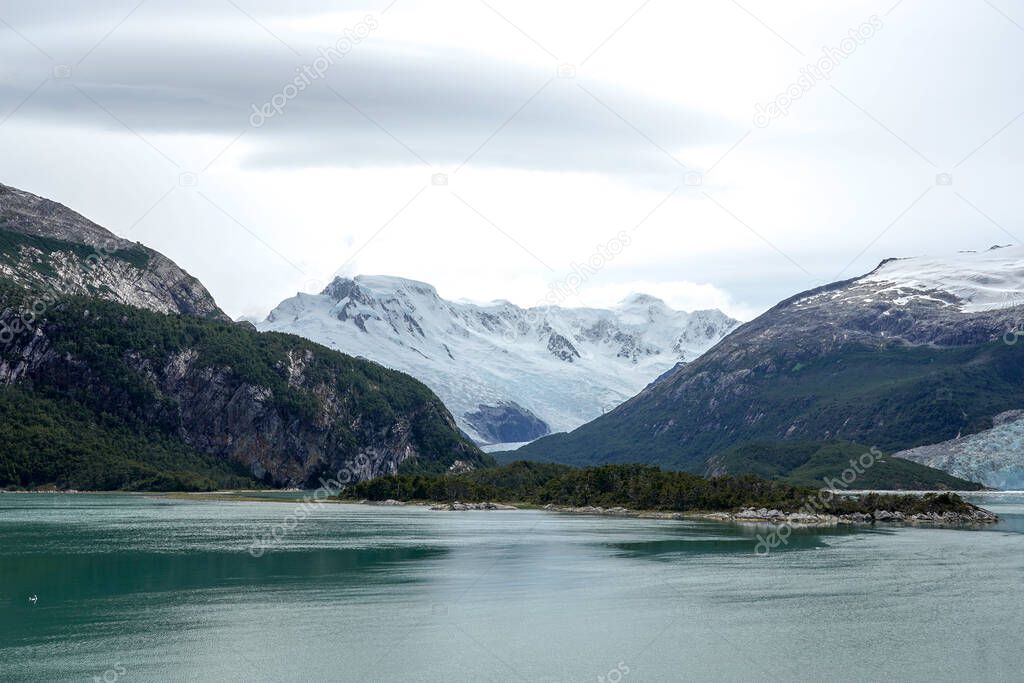 Cruising Beagle Channel in Chilean  Patagonia. is a strait in Tierra del Fuego Archipelago on the extreme southern tip of South America between Chile and Argentina