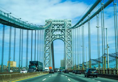 NEW YORK - MAY 21, 2020: Crossing the George Washington Bridge. It is a double-decked suspension bridge spanning the Hudson River, connecting the New York City borough of Manhattan with the New Jersey borough of Fort Lee clipart