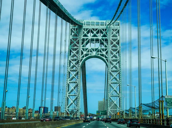 NEW YORK - MAY 21, 2020: Crossing the George Washington Bridge. It is a double-decked suspension bridge spanning the Hudson River, connecting the New York City borough of Manhattan with the New Jersey borough of Fort Lee