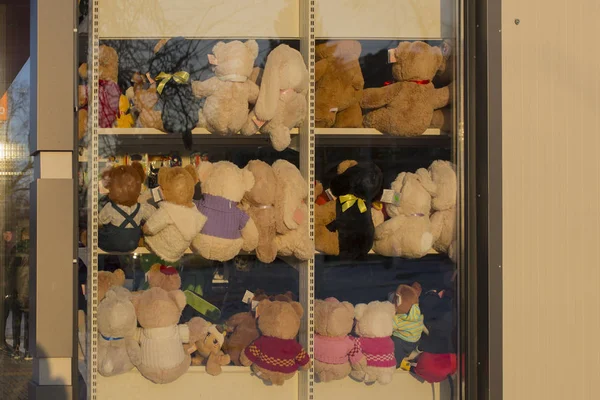 Showcase with toys. Teddy bears on the shelf. Shop for children.