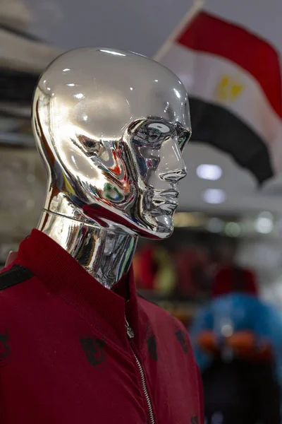 Clothes on mannequins. Design stores, advertising fashion. Metal man.