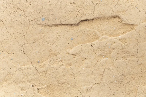 Concrete coating. Cracked stone background. Cement slab. Wall of the house.