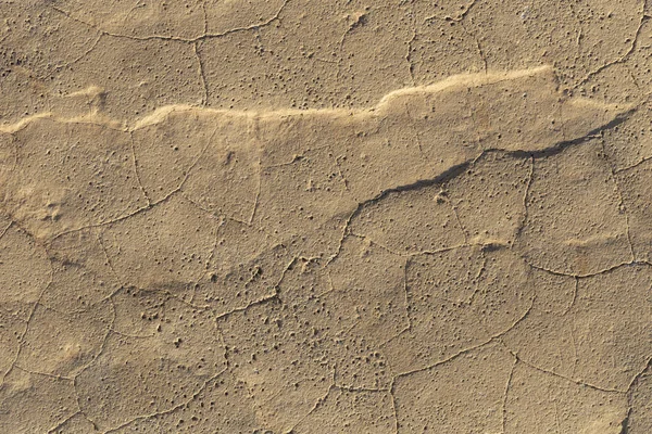 Concrete coating. Cracked stone background. Cement slab. Wall of the house.