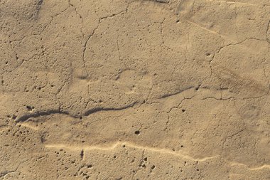 Beton kaplama. Çatlak taş arka plan. Çimento tabakası. Evin duvarı..