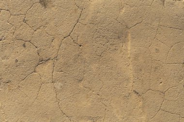 Beton kaplama. Çatlak taş arka plan. Çimento tabakası. Evin duvarı..