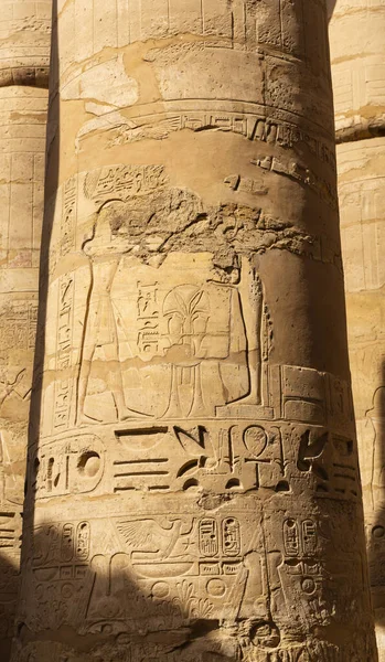 Luxor Governorate, Egypt, Karnak Temple, complex of Amun-Re. Embossed hieroglyphics on columns and walls. Min  is an ancient Egyptian god.