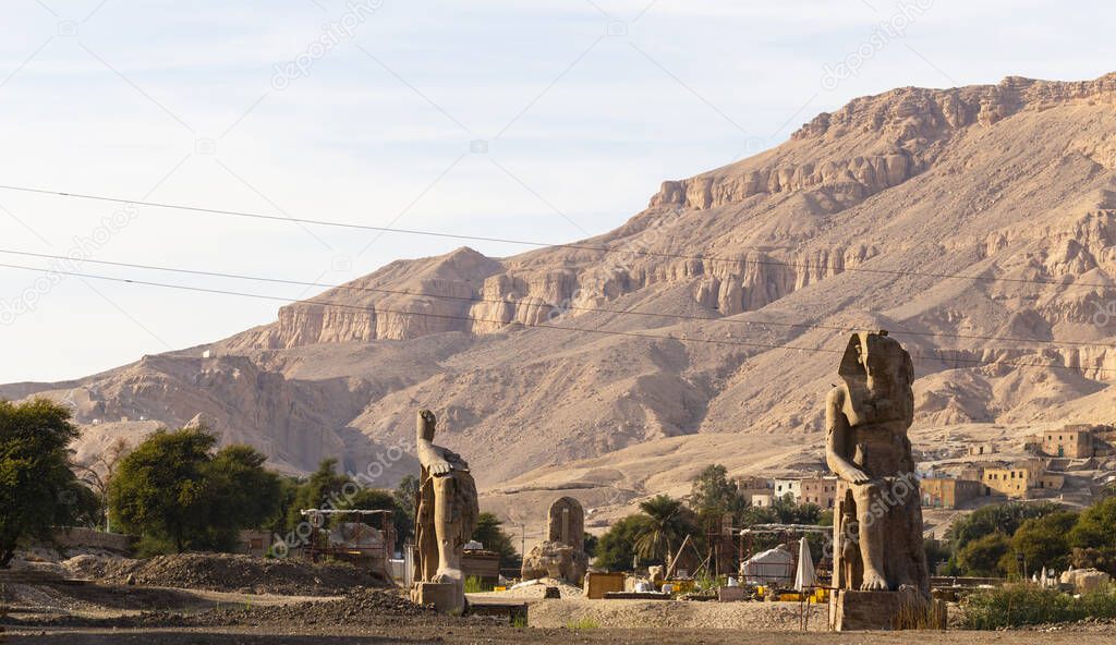 Colossi of Memnon are two massive stone statues Pharaoh Amenhotep III, who reigned in Egypt during the Dynasty XVIII.