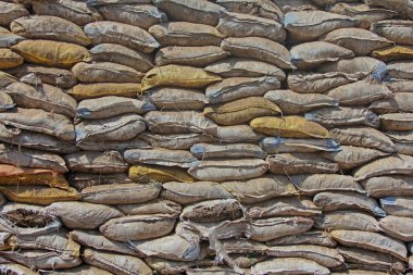 Pile of white sand bags on construction site