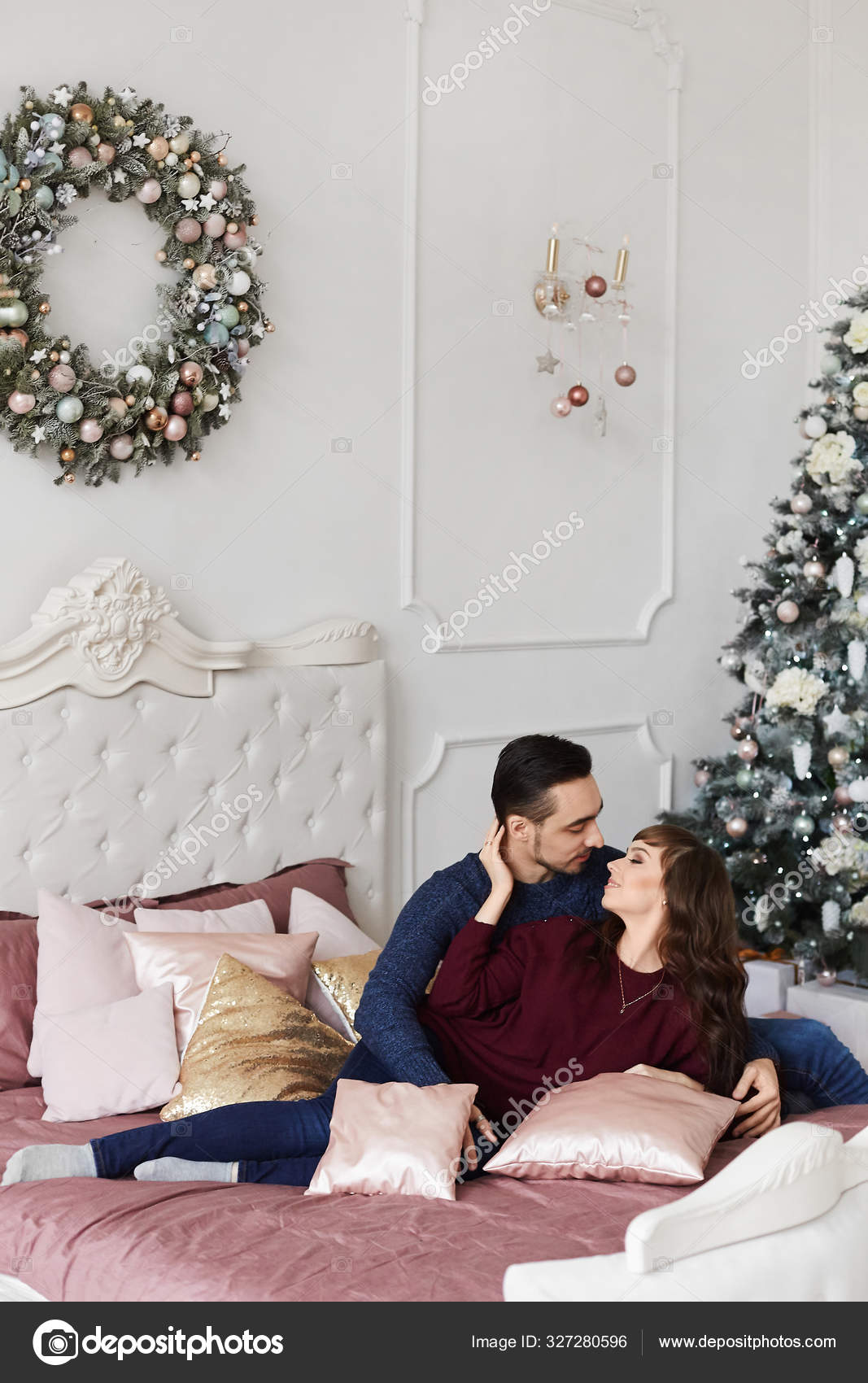 Sweet Couple Hugging Each Other On The Bed In Bedroom