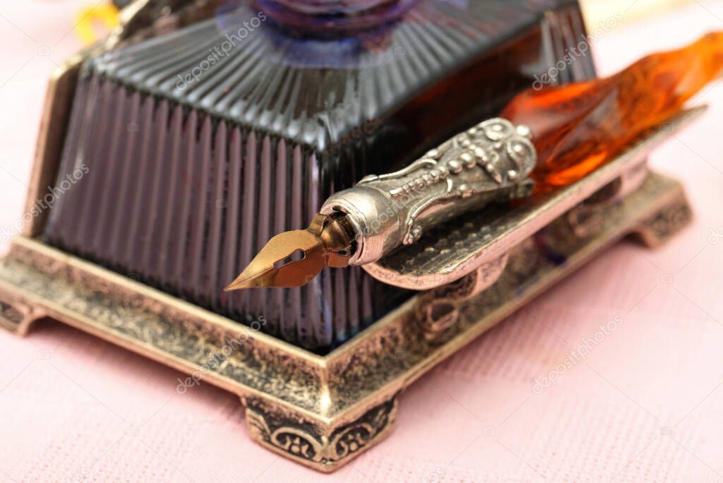Quill with inkwell, closeup