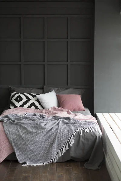 A bed in an interior with pillows — Stock Photo, Image