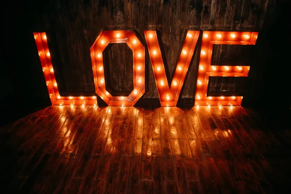Symbol love retro letters big luminous background — Stock Photo, Image