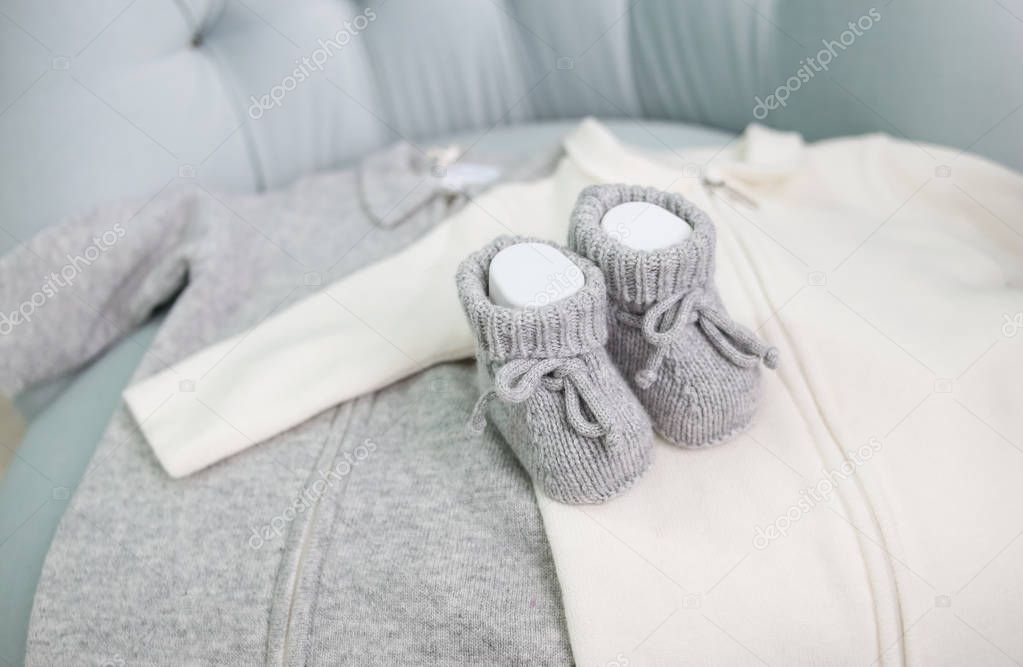 clothes baby shoes chair gray white
