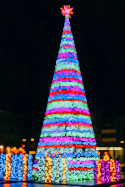 Background christmas tree blur square brightly garlanded — Stock Photo, Image