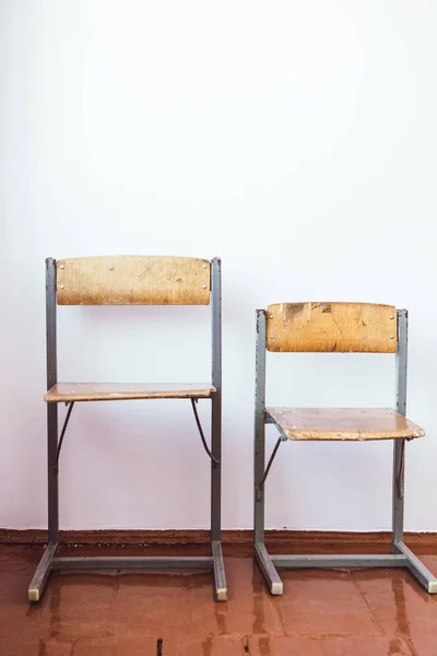 two different retro chairs background small large