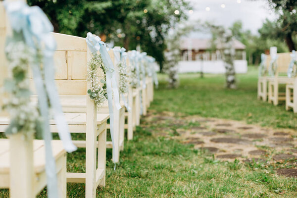 event wedding ceremony decor white chair flowers