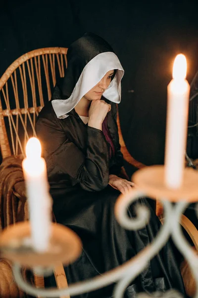 Halloween mystic nun hood candle candelabrum fire — Stock Photo, Image