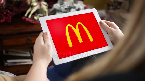 Circa January 2018 Woman Looking Mcdonald Logo Her Tablet — стоковое видео